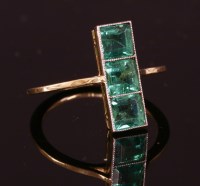 Lot 176 - An Art Deco three stone green paste ring