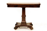 Lot 525 - An early 19th century mahogany and crossbanded tea table