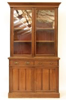 Lot 656 - A late Victorian walnut bookcase cabinet