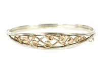 Lot 172 - A sterling silver and Welsh gold hinge bangle