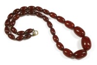 Lot 164 - A single row graduated cherry coloured olive shaped Bakelite bead necklace (with swirls) 
26.77g