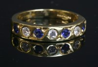 Lot 371 - An 18ct gold sapphire and diamond half eternity ring