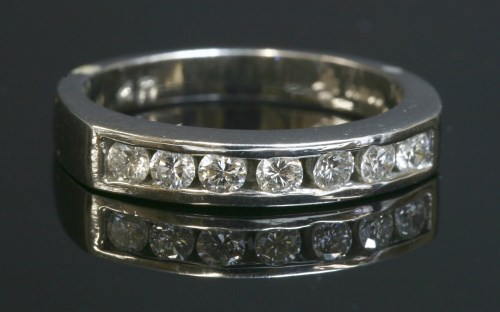 Lot 452 - A platinum diamond set half eternity ring