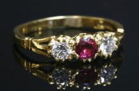 Lot 299 - An 18ct gold ruby and diamond three stone ring