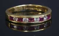 Lot 294 - An 18ct gold ruby and diamond half eternity ring