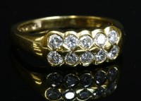 Lot 427 - An 18ct gold two row diamond set band ring