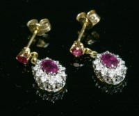Lot 271 - A pair of 18ct gold ruby and diamond cluster drop earrings