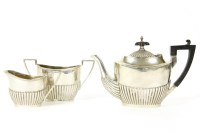 Lot 233 - A Walker & Hall Edwardian silver three piece bachelors tea set