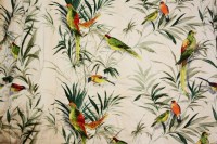 Lot 477 - A pair of white ground curtains with a parrot print