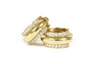 Lot 130 - A pair of 18ct gold diamond set hinge hoop earrings