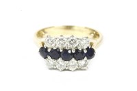 Lot 11 - An 18ct gold three row sapphire and diamond ring