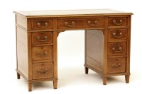 Lot 518 - An Edwardian mahogany and cross banded twin pedestal desk