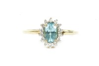 Lot 112 - A 9ct gold oval cut apatite and white stone cluster ring