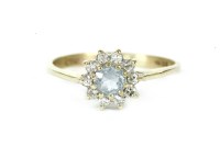 Lot 110 - A 9ct gold circular cut aquamarine and diamond cluster ring