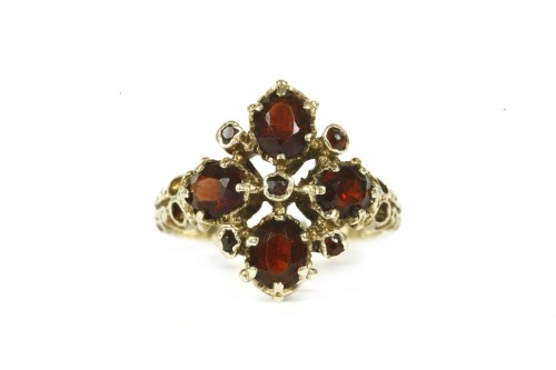 Lot 40 - A 9ct gold four stone garnet cluster ring