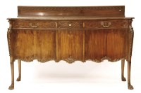 Lot 516 - A large serpentine fronted mahogany sideboard