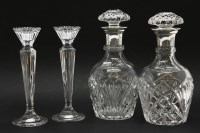 Lot 269 - A pair of cut glass decanters with silver collars