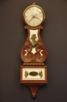Lot 371 - A modern wooden wall clock
