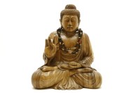 Lot 418 - A South East Asian carved wooden figure of a Buddha