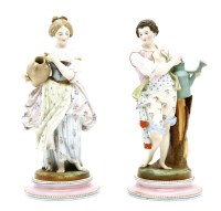 Lot 293 - A pair of Victorian coloured bisque figures of gardeners