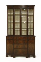 Lot 637 - A George III style mahogany breakfront bookcase cabinet