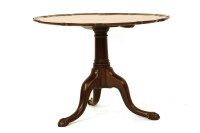 Lot 618 - An 18th century Irish mahogany tilt top supper table