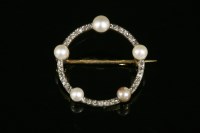 Lot 679 - A pearl and diamond circle brooch