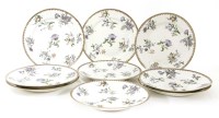 Lot 1089 - A set of nine Chinese porcelain famille rose circular plates