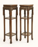 Lot 1334 - A pair of Chinese black wood hongmu square pedestal tables