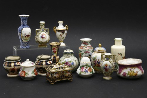 Lot 231 - A box with small ceramic items: vases