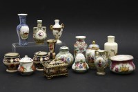 Lot 231A - A box with small ceramic items: vases