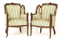 Lot 614 - A pair of late Victorian carved mahogany armchairs