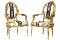 Lot 602 - A pair of French gilt armchairs