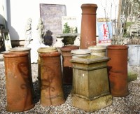 Lot 1124 - A collection of eleven terracotta chimney pots of various sizes