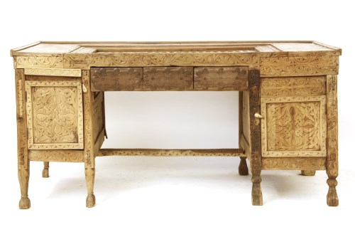 Lot 592 - A Pakistani/North Indian carved hardwood pedestal desk