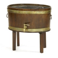 Lot 667 - A George III style mahogany wine cooler