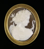 Lot 40 - A Victorian carved shell cameo brooch depicting Cupid