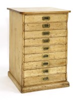 Lot 591 - A pine pedestal chest of nine drawers on plinth base