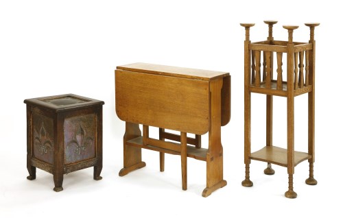 Lot 599 - An Arts and Crafts oak plant stand