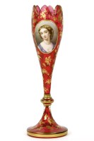 Lot 238 - A Bohemian ruby glass and gilt highlighted vase