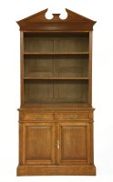 Lot 662 - A Victorian oak bookcase by Maple and Co