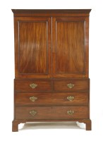 Lot 650 - A George III mahogany press cupboard