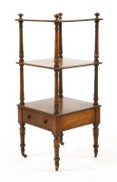 Lot 654 - A 19th century three tier mahogany whatnot