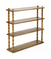 Lot 657 - A Regency hanging four shelf wall shelf with faux bamboo supports