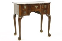 Lot 673 - An oak two drawer side table