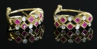 Lot 308 - A pair of Continental ruby and diamond cuff-style earrings