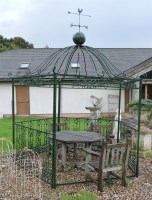 Lot 689 - A large iron and green painted pentagonal garden pagoda