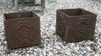 Lot 695 - A pair of small cast iron cuboid planters