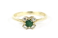 Lot 19 - A gold circular emerald cut ring with four diamonds