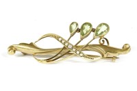 Lot 53 - An Edwardian 9ct gold pear shaped peridot and split pearl bar brooch 
2.85g